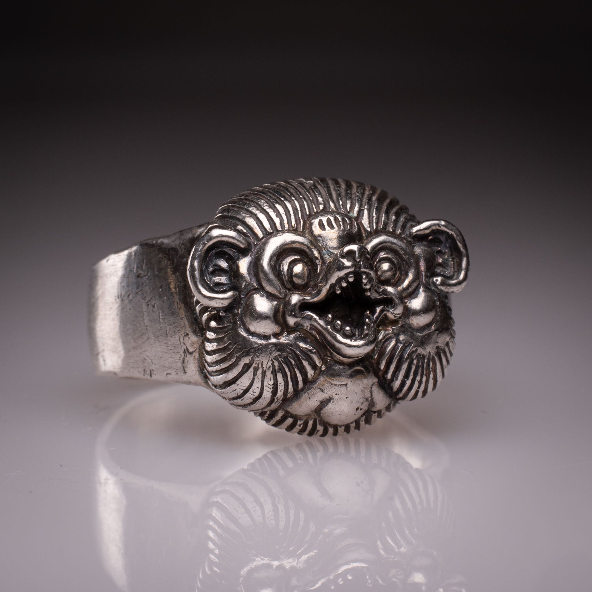 Handcrafted 925 silver Tanuki Mask Ring showing the intricate facial features and tattoo-inspired details designed by David Saez for KaijuLab.