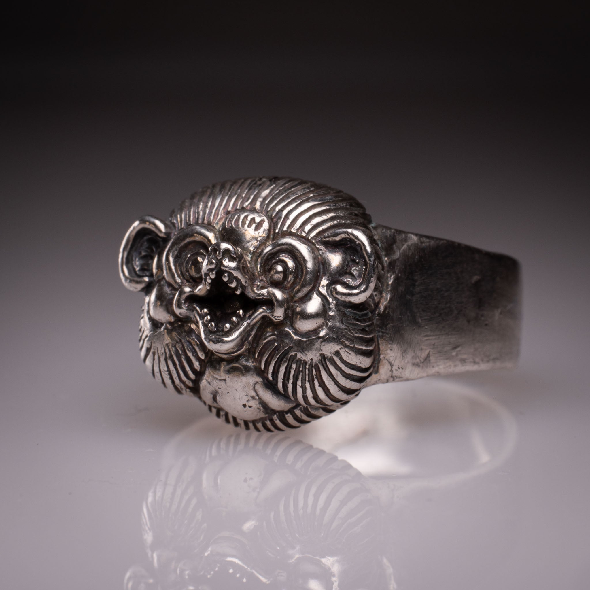 Handcrafted 925 silver Tanuki Mask Ring showing the intricate facial features and tattoo-inspired details designed by David Saez for KaijuLab.