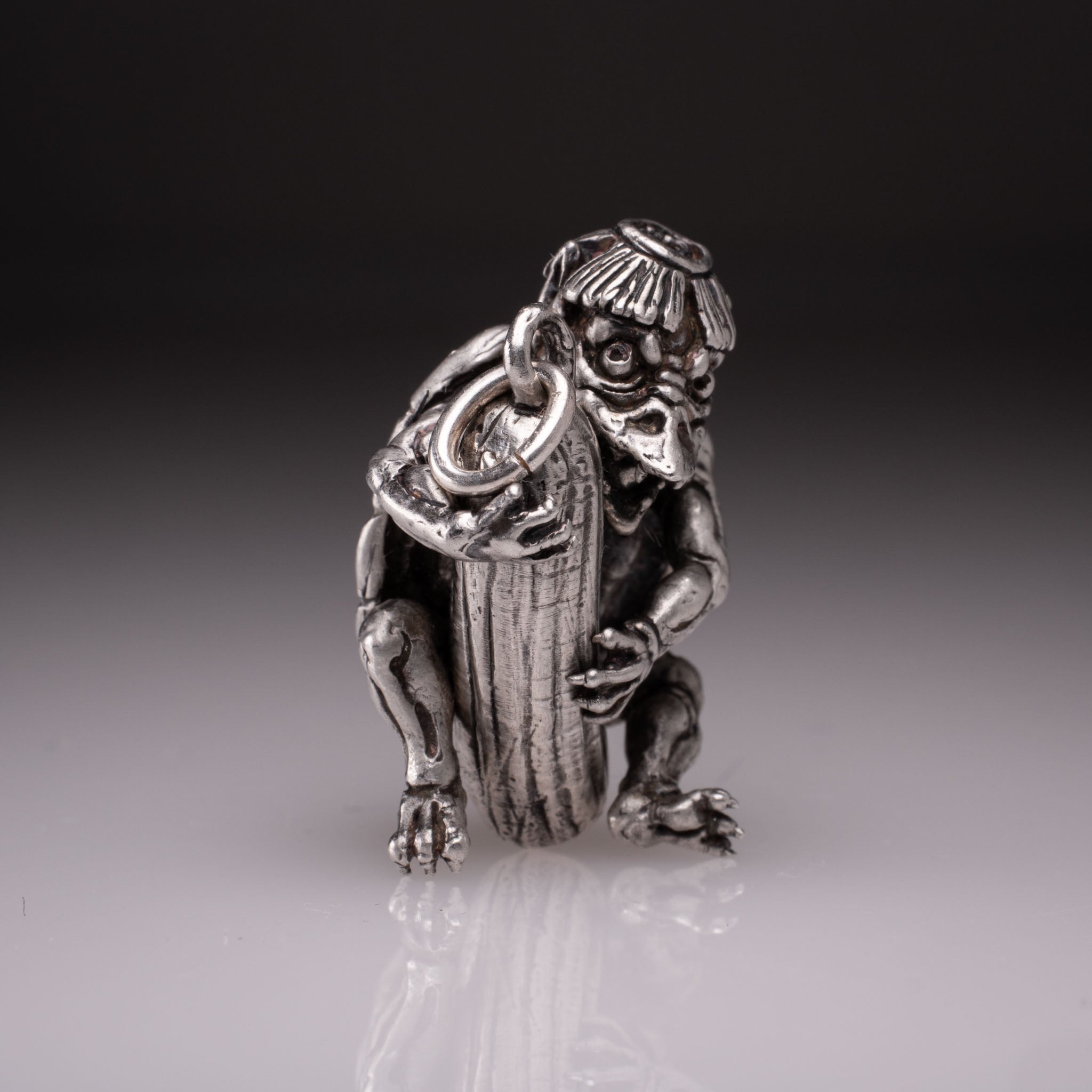 Handcrafted 925 silver full-body Kappa Yokai pendant hugging a cucumber, featuring detailed shell and tattoo art style by David Saez for KaijuLab.