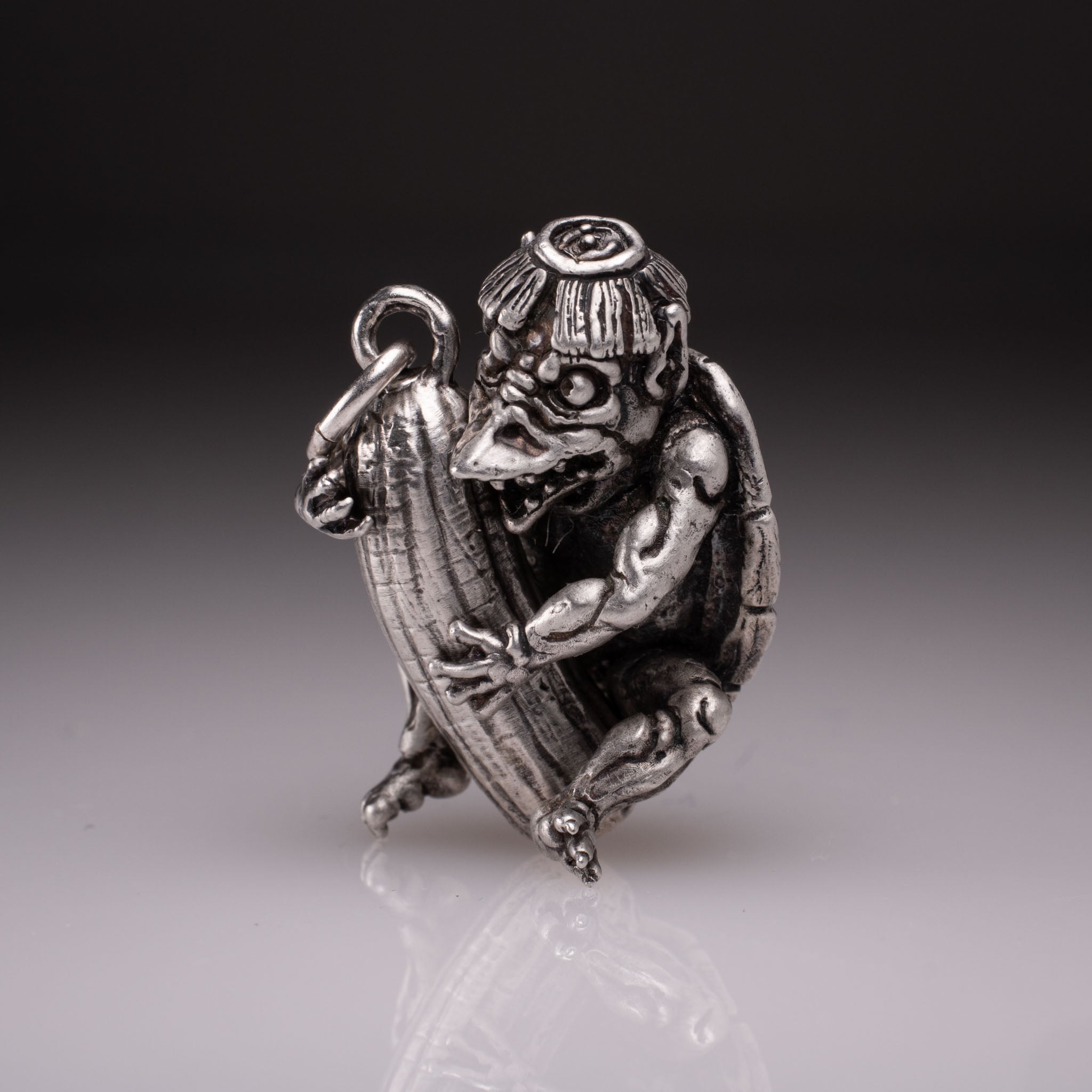 Handcrafted 925 silver full-body Kappa Yokai pendant hugging a cucumber, featuring detailed shell and tattoo art style by David Saez for KaijuLab.