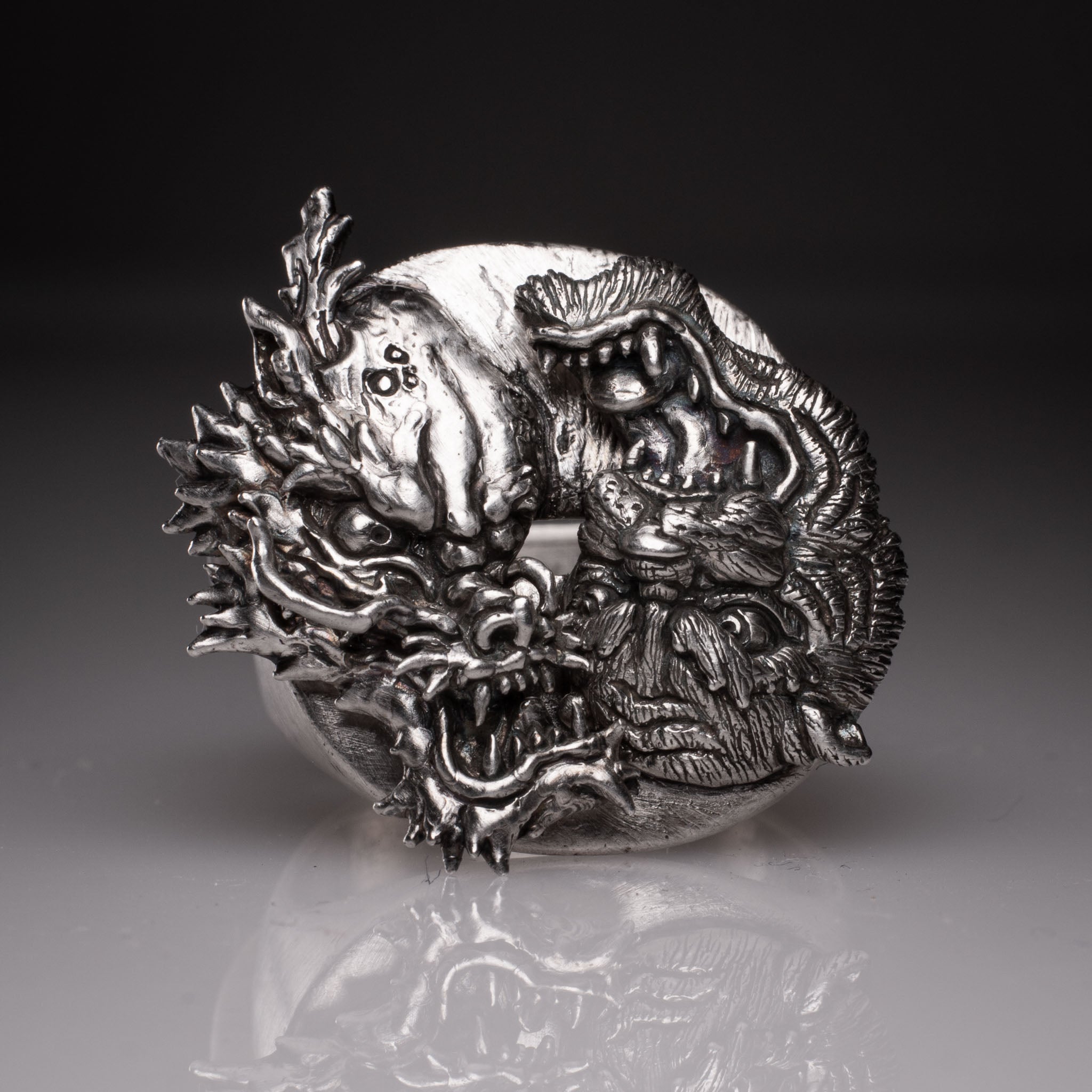 Two 925 silver rings forming a Yin Yang circle when joined, featuring detailed faces of a Dragon and a Tiger, handcrafted by KaijuLab.