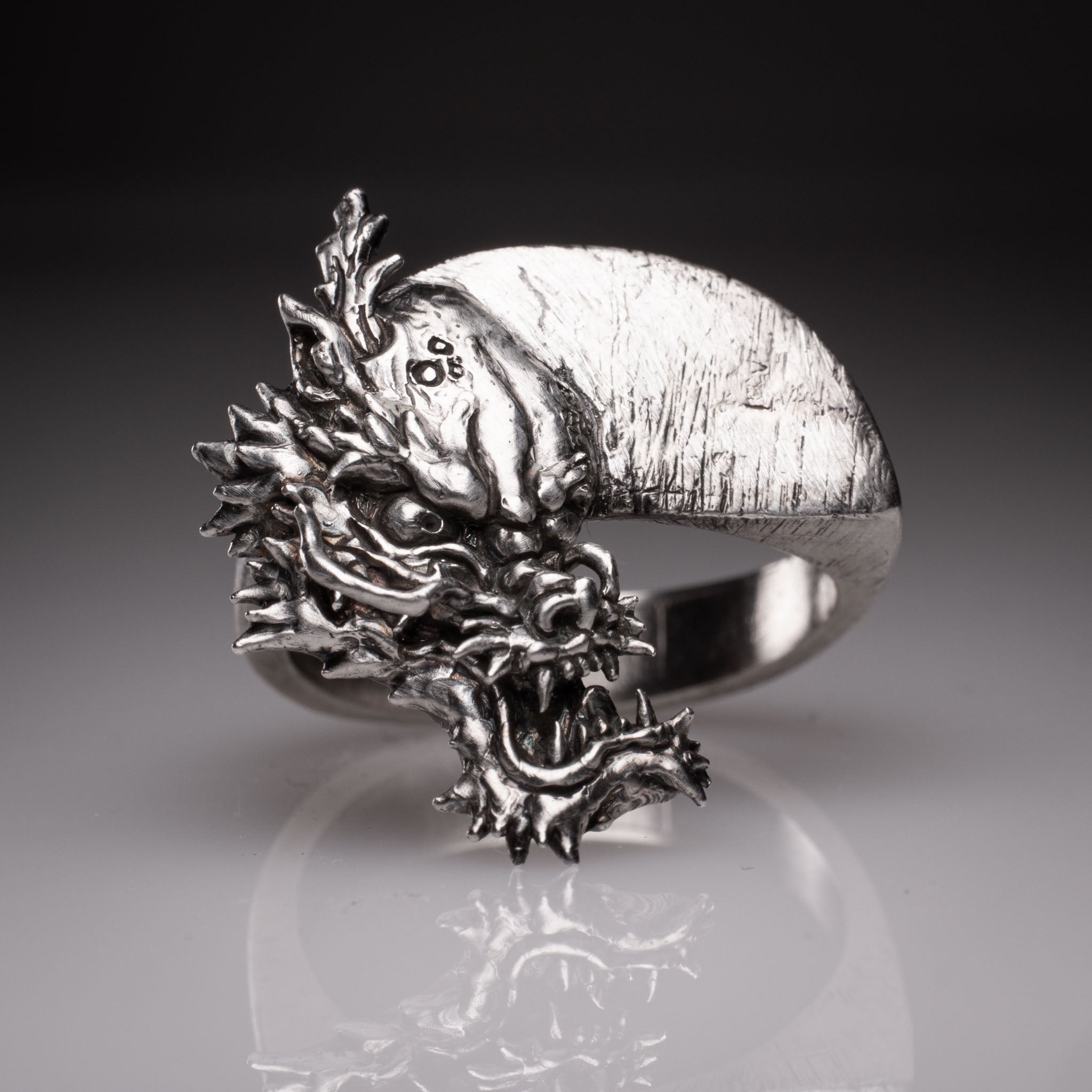 Two 925 silver rings forming a Yin Yang circle when joined, featuring detailed faces of a Dragon and a Tiger, handcrafted by KaijuLab.