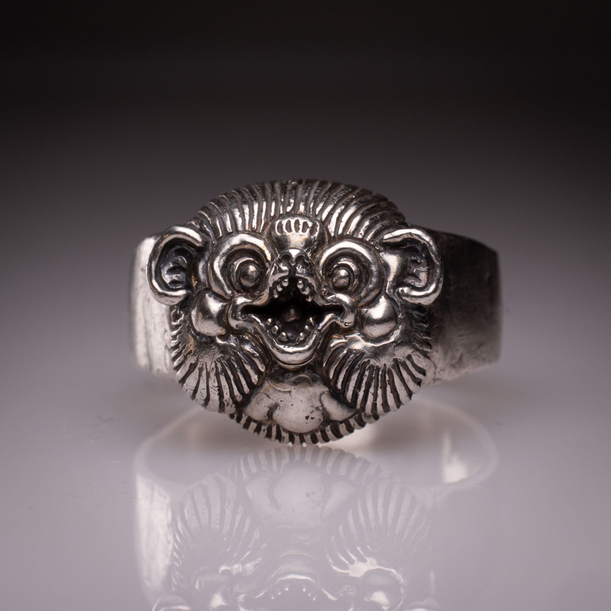 Handcrafted 925 silver Tanuki Mask Ring showing the intricate facial features and tattoo-inspired details designed by David Saez for KaijuLab.