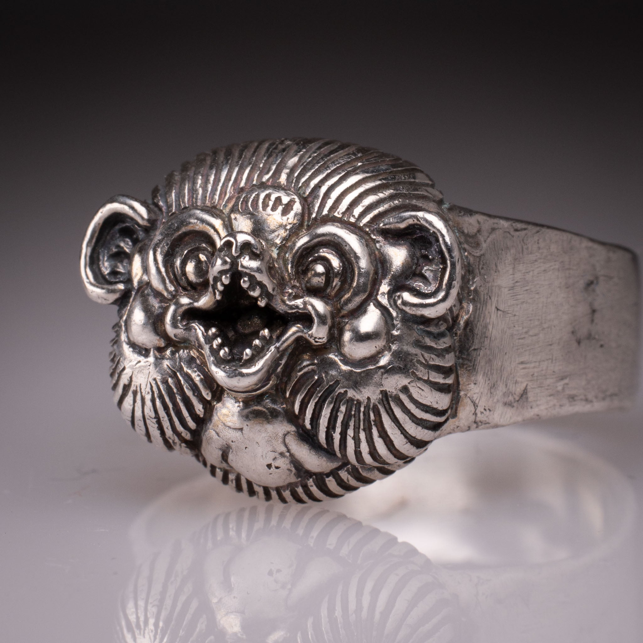 Handcrafted 925 silver Tanuki Mask Ring showing the intricate facial features and tattoo-inspired details designed by David Saez for KaijuLab.
