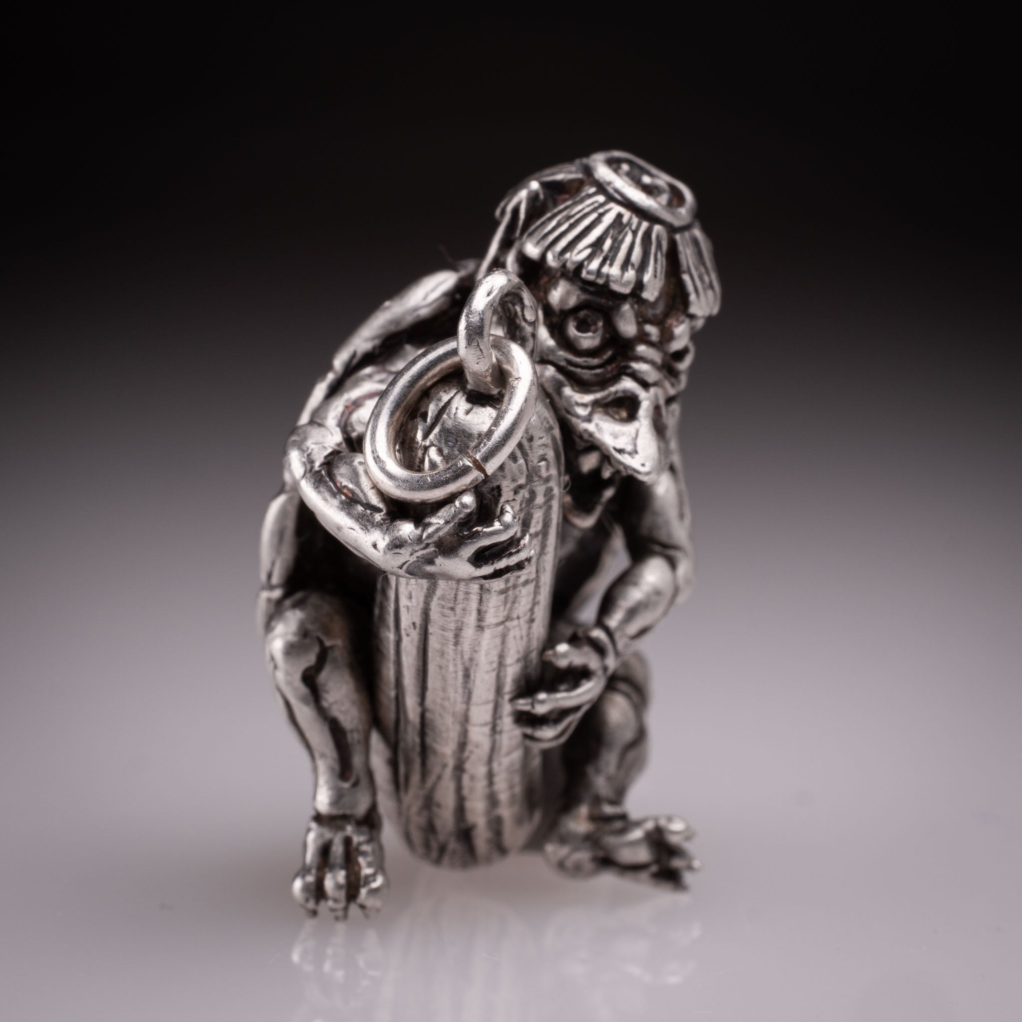 Handcrafted 925 silver full-body Kappa Yokai pendant hugging a cucumber, featuring detailed shell and tattoo art style by David Saez for KaijuLab.