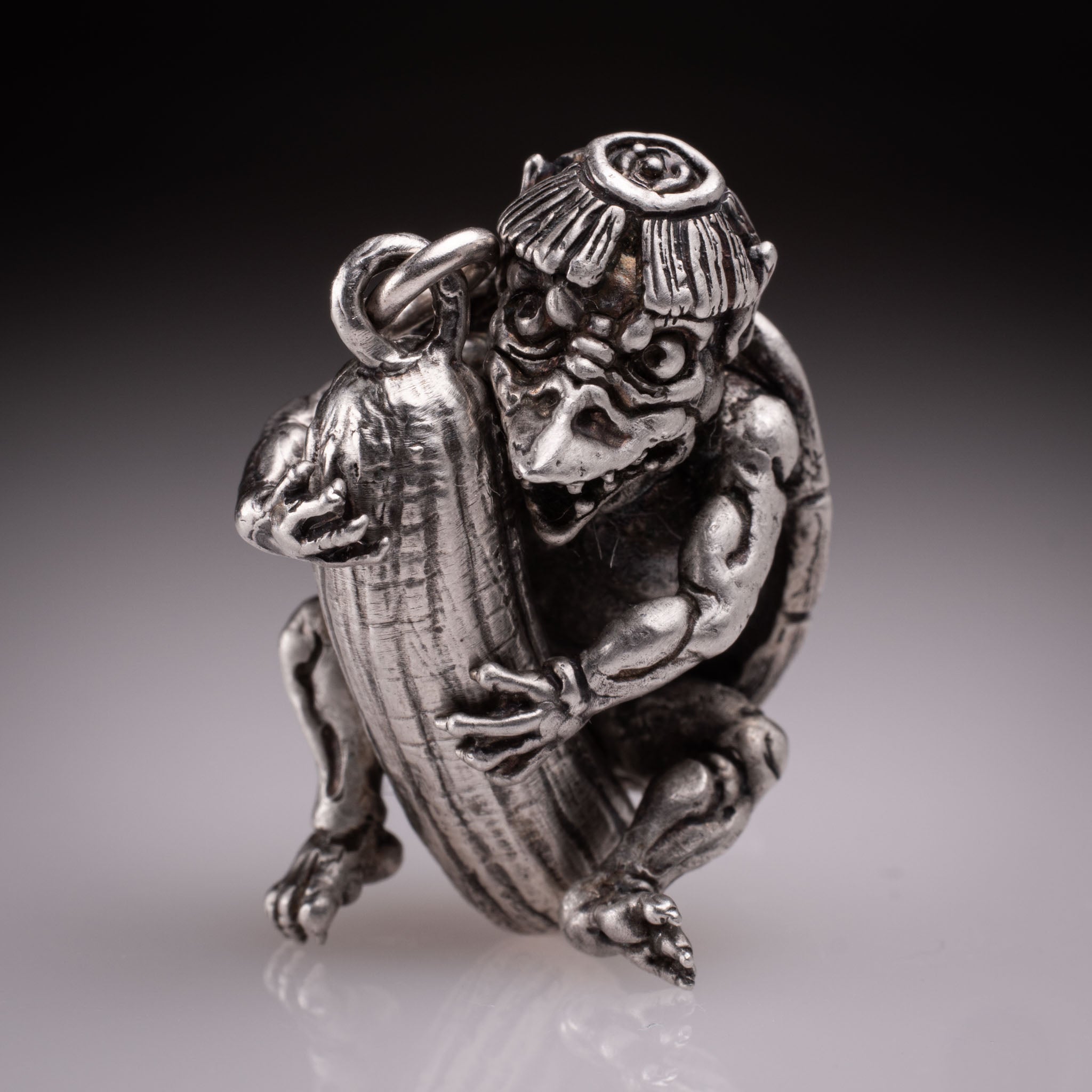 Handcrafted 925 silver full-body Kappa Yokai pendant hugging a cucumber, featuring detailed shell and tattoo art style by David Saez for KaijuLab.