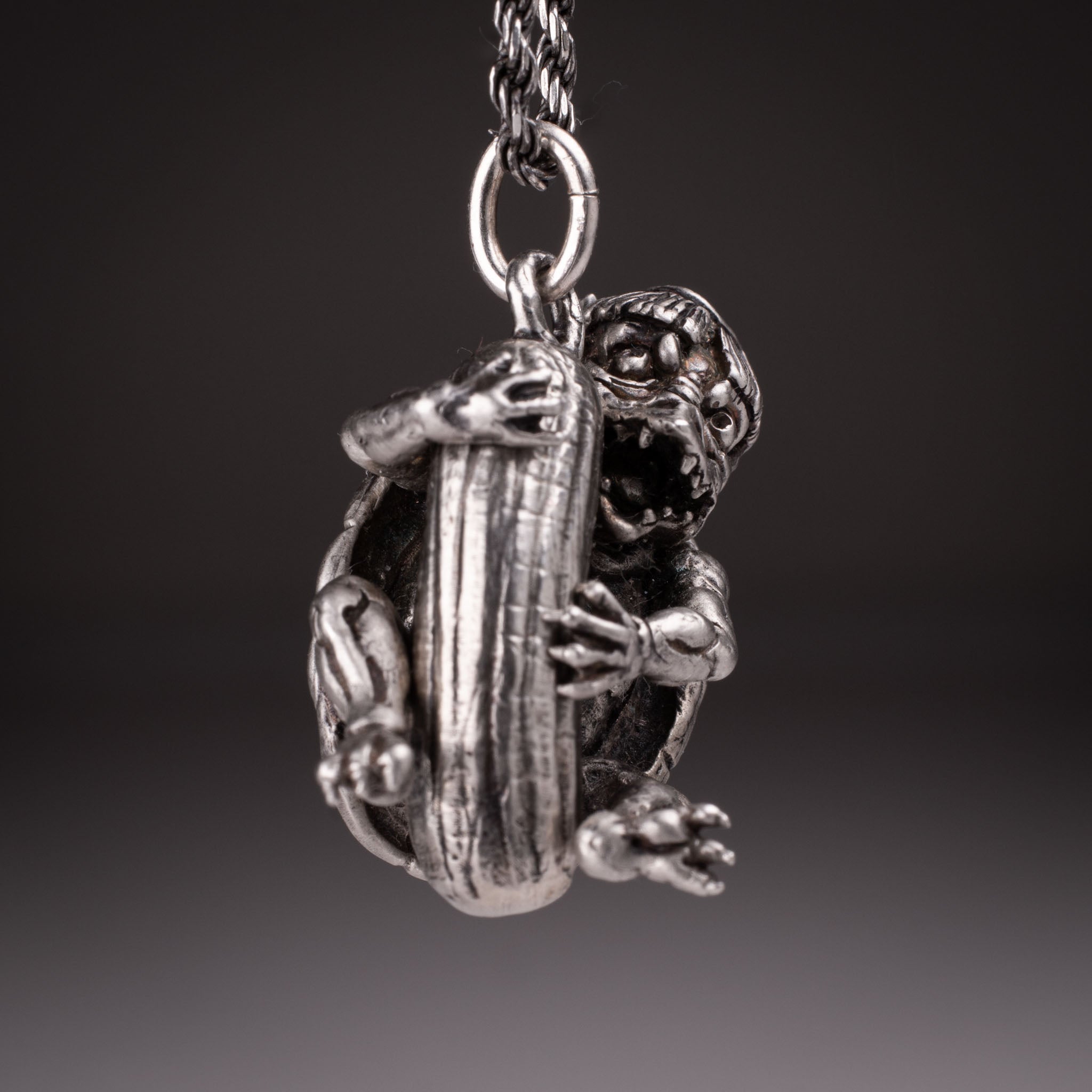 Handcrafted 925 silver full-body Kappa Yokai pendant hugging a cucumber, featuring detailed shell and tattoo art style by David Saez for KaijuLab.