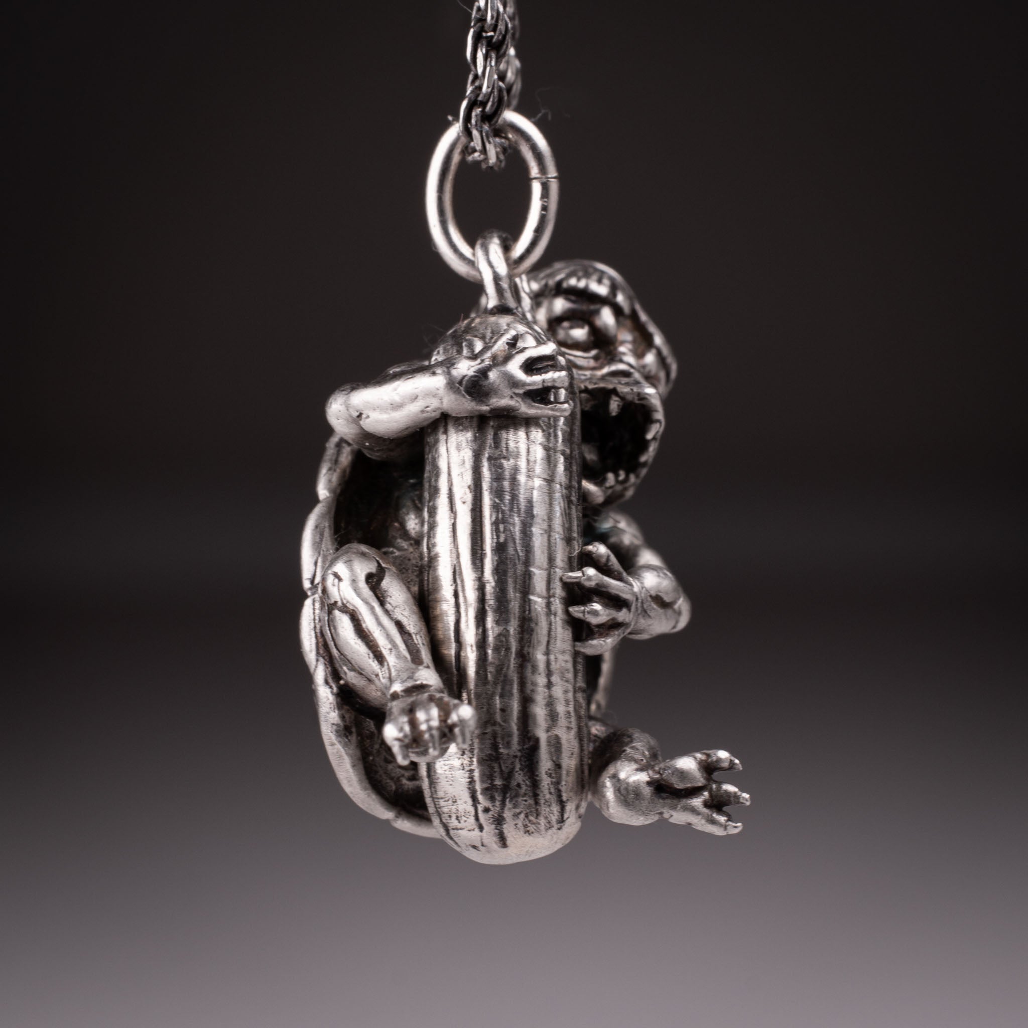 Handcrafted 925 silver full-body Kappa Yokai pendant hugging a cucumber, featuring detailed shell and tattoo art style by David Saez for KaijuLab.